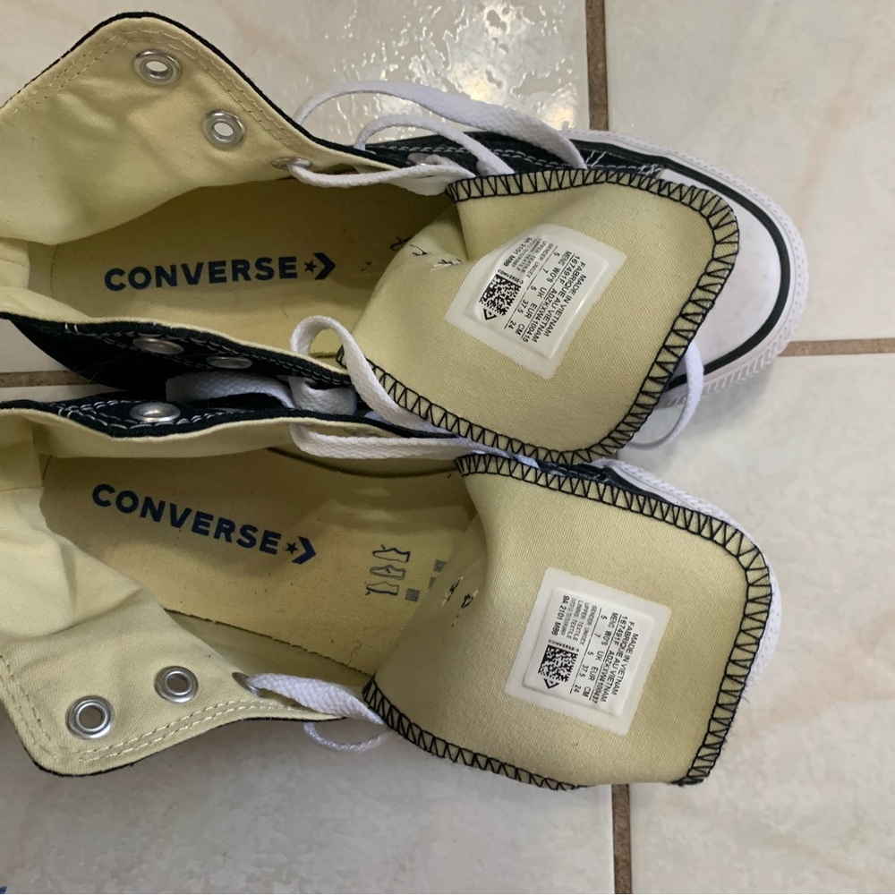 Converse high top  sneakers.  Black and white - size 7 women or 5 men.